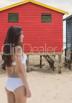 Woman at the beach standing in the sand