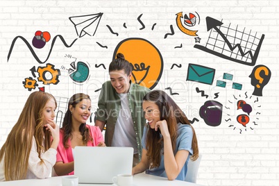 Happy business people at a desk looking at a computer against white wall with graphics