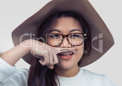 Portrait of woman being silly with grey background