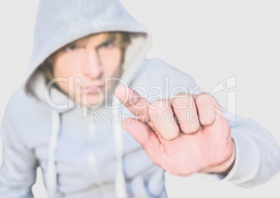 Portrait of Man wearing hoodie with grey background