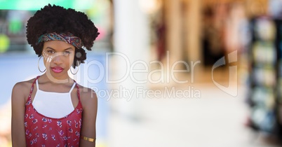 Hippie woman against blurry shopping centre