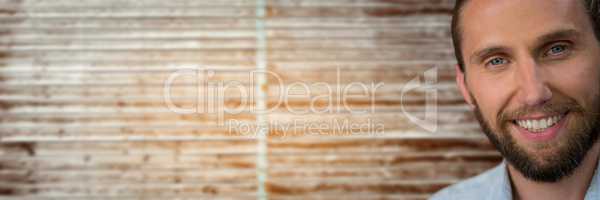 Portraiture of bearded man against blurry wood panel