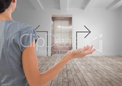 Confused business woman against white room background with grey arrows