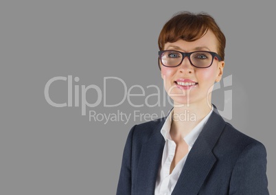 Portrait of businesswoman wearing glasses with grey background