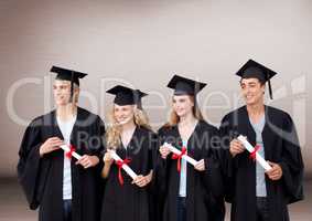 Group of graduates standing in front of blank brown background