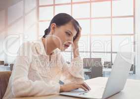 Business woman at a desk using a computer
