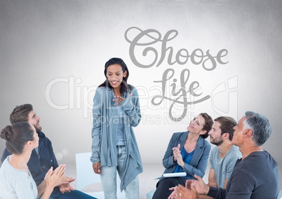 Group of business people sitting in circle meeting in front of Choose Life text