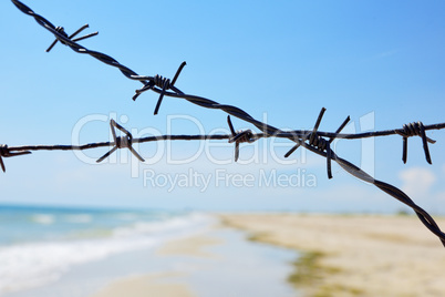 Fencing of the sea shore with barbed iron wire