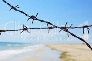 Fencing of the sea shore with barbed iron wire