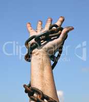right female hand holds a rusty chain