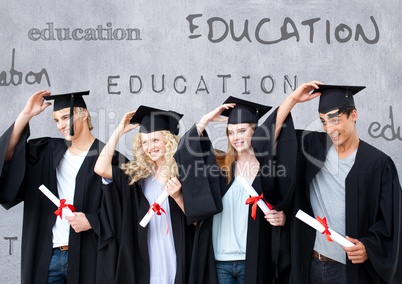 Group of graduates standing in front of education text
