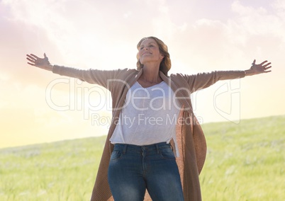 Woman practicing casual Mindfulness in front of nature field