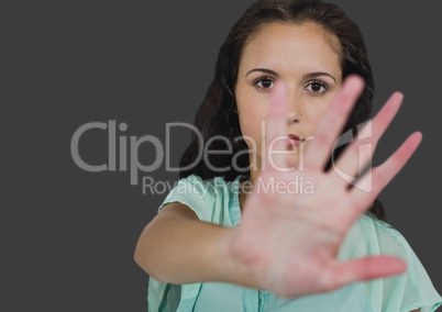 Portrait of woman stopping photo taken with grey background