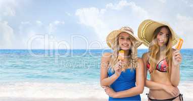 Happy women at the beach eating  ice cream