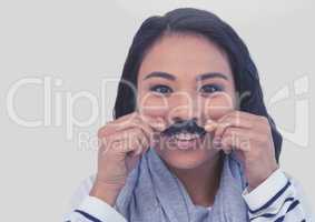 Portrait of woman wearing mustache with grey background
