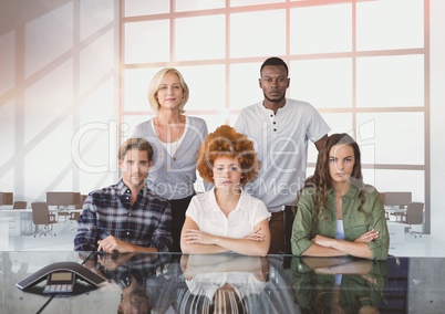 Business people at a desk looking  angry