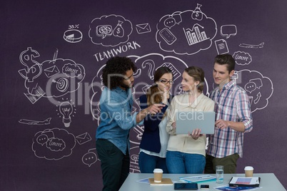 Happy business people at a desk looking at a computer against purple background with graphics