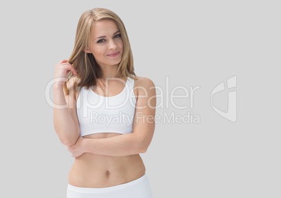 Portrait of beautiful fit  sporty woman with grey background