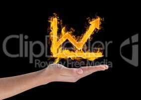 Hand holding fiery graph with arrow over black background