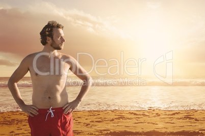 Man at the beach standing in the sand