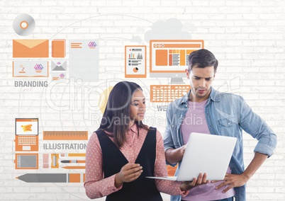 Happy business people using a computer against white wall with graphics