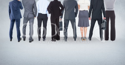 Group of business people standing in front of blank bright background
