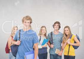 Group of students standing in front of blank grey background