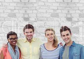 Group of people standing in front of bright brick wall