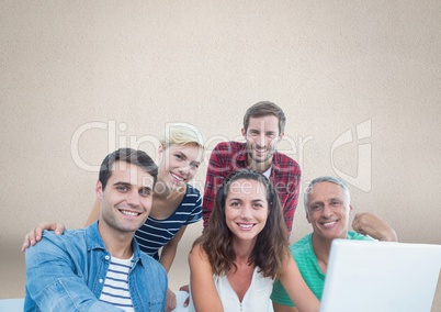 Group of people on laptop in front of brown background