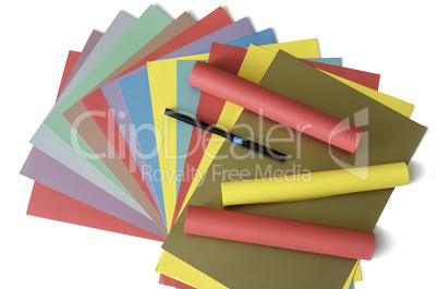 Sheets of colored paper on a white background.
