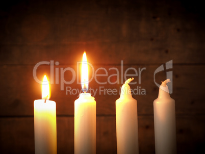 Advent candles on a wooden background