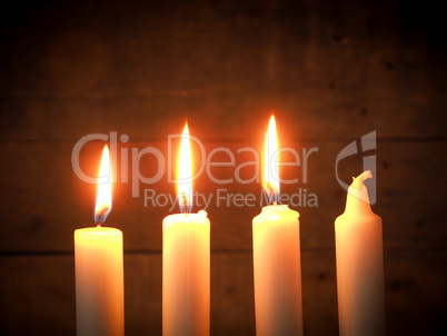 Advent candles on a wooden background