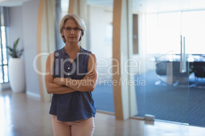 Portrait of mature businesswoman with arms crossed