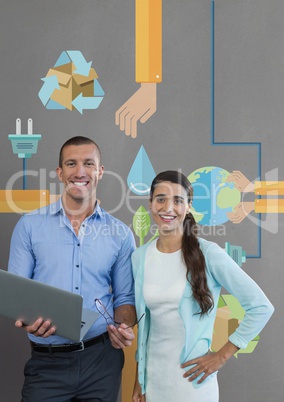 Happy business people holding a computer against grey background with graphics