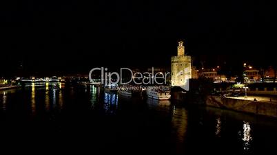 Night view of the river in Seville (Spain). Timelapse