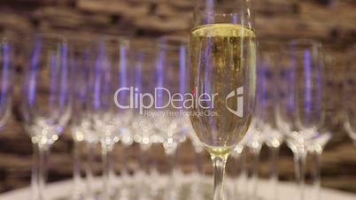 Champagne in wineglass, in a restaurant, Restaurant interior, buffet table, close-up