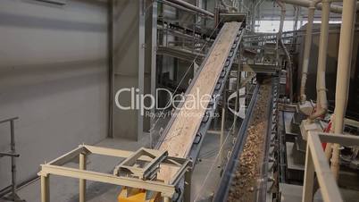 Conveyor belt on factory, Ceramic factory equipment, Transportation of clay on the conveyor, industrial interior, Transportation of raw materials on the conveyor