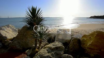 Sun reflecting off the sea on a beach, Puerto Sherry, Cadiz, Spain