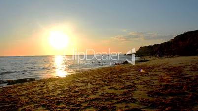 Sun reflecting off the sea on a beach, Puerto Sherry, Cadiz, Spain