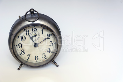 old clock on a white background