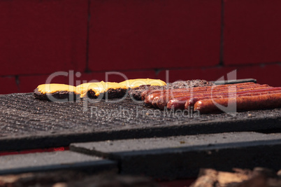 Sausage and hamburger on a barbecue