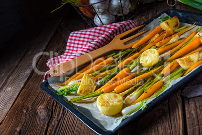 caramelised carrots, spring onions and baked potatoes