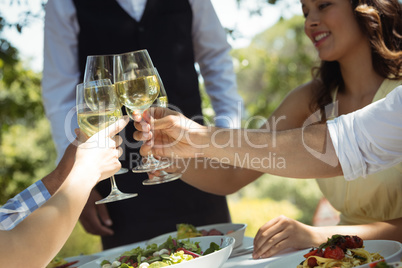 Group of friends toasting champagne glasses