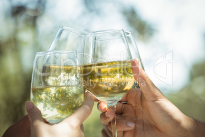 Group of friends toasting champagne glasses in a restaurant