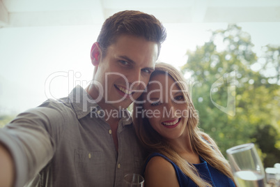 Portrait of smiling couple having champagne