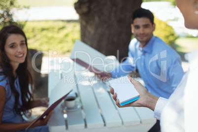 Waitress writing order on notepad