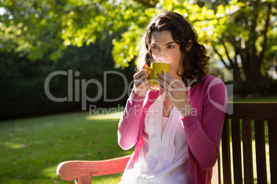 Thoughtful woman drinking a cup of coffee