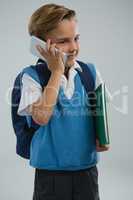 Schoolboy talking on mobile phone