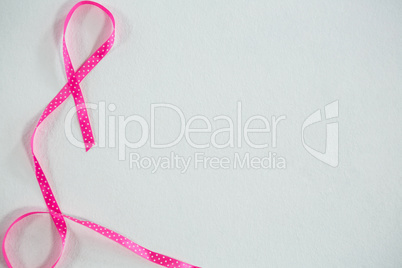 Overhead view of pink spotted Breast Cancer Awareness ribbon