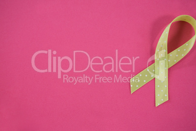 Overhead view of spotted green Lymphoma Awareness ribbon